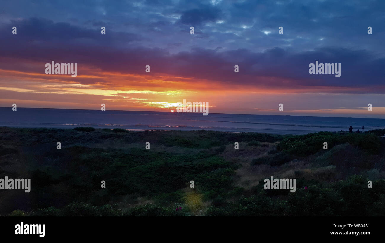 Tramonto sul mare del Nord su Langeoog, Germania Foto Stock