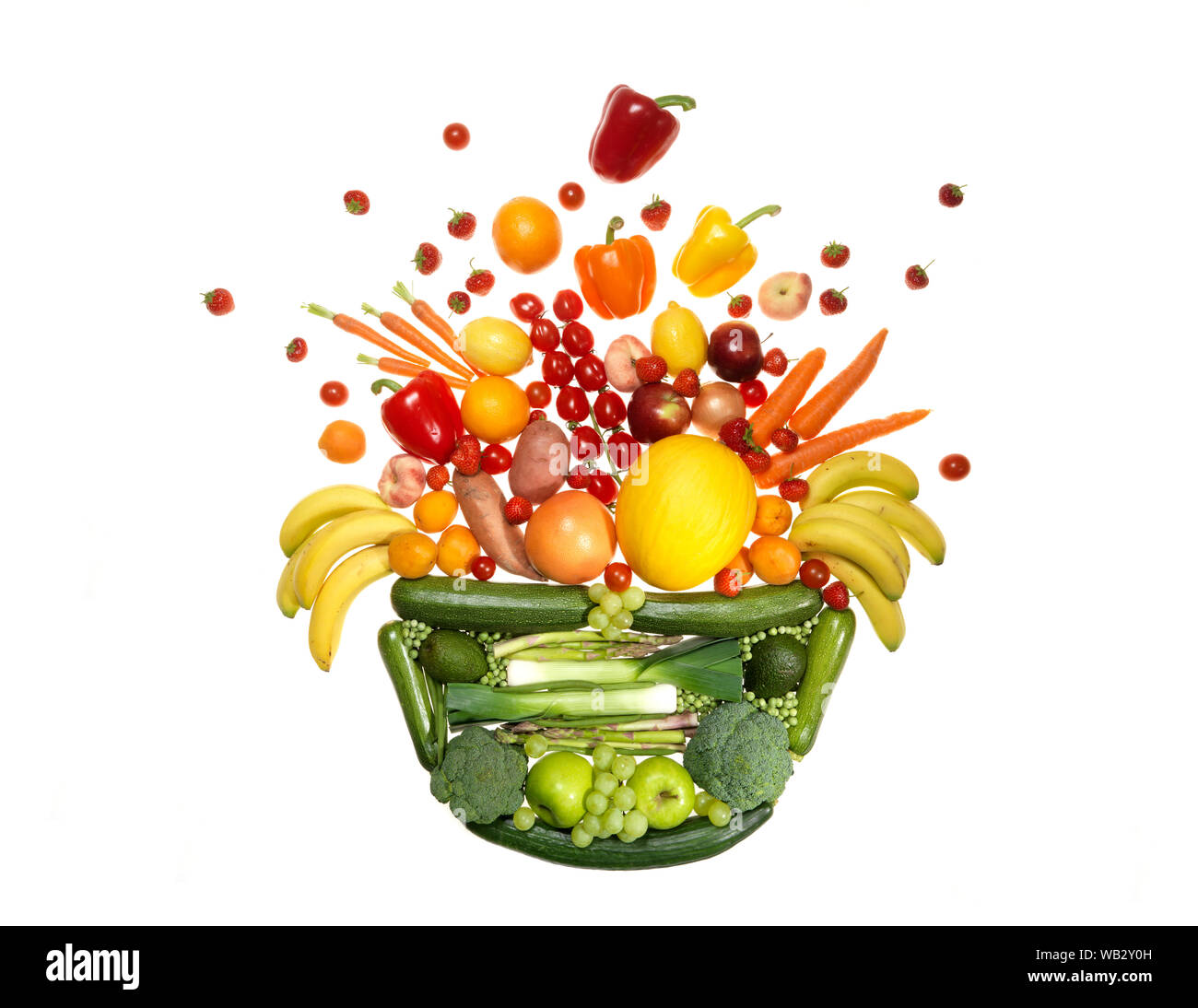 Ciotola di frutta e verdura di esplodere con la bontà. Foto Stock