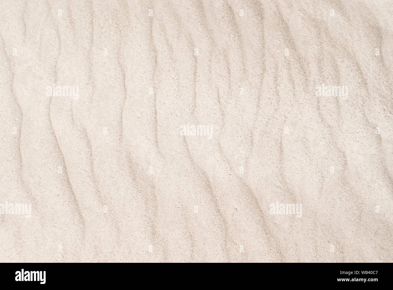 Sfondo - dune del deserto vicino, increspature sulla superficie di sabbia Foto Stock
