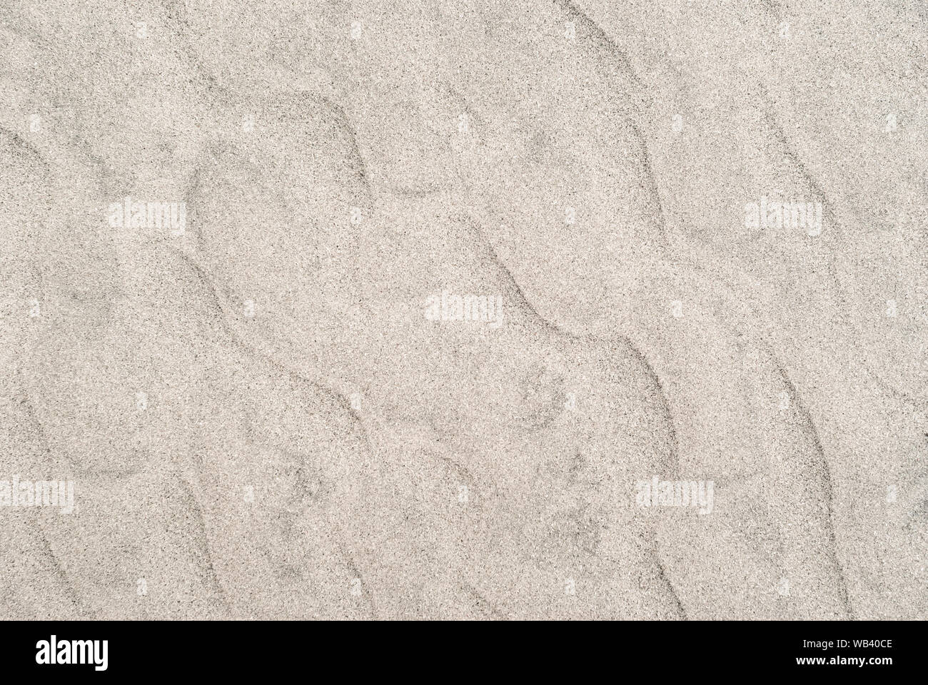 Sfondo - dune del deserto vicino, increspature sulla superficie di sabbia Foto Stock