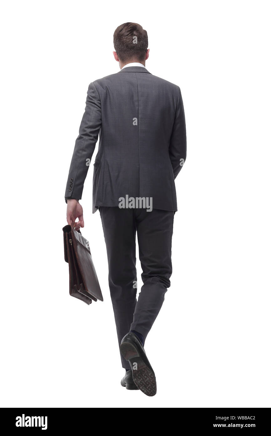 Vista posteriore. fiducioso uomo d affari con fiducia passi avanti . Foto Stock