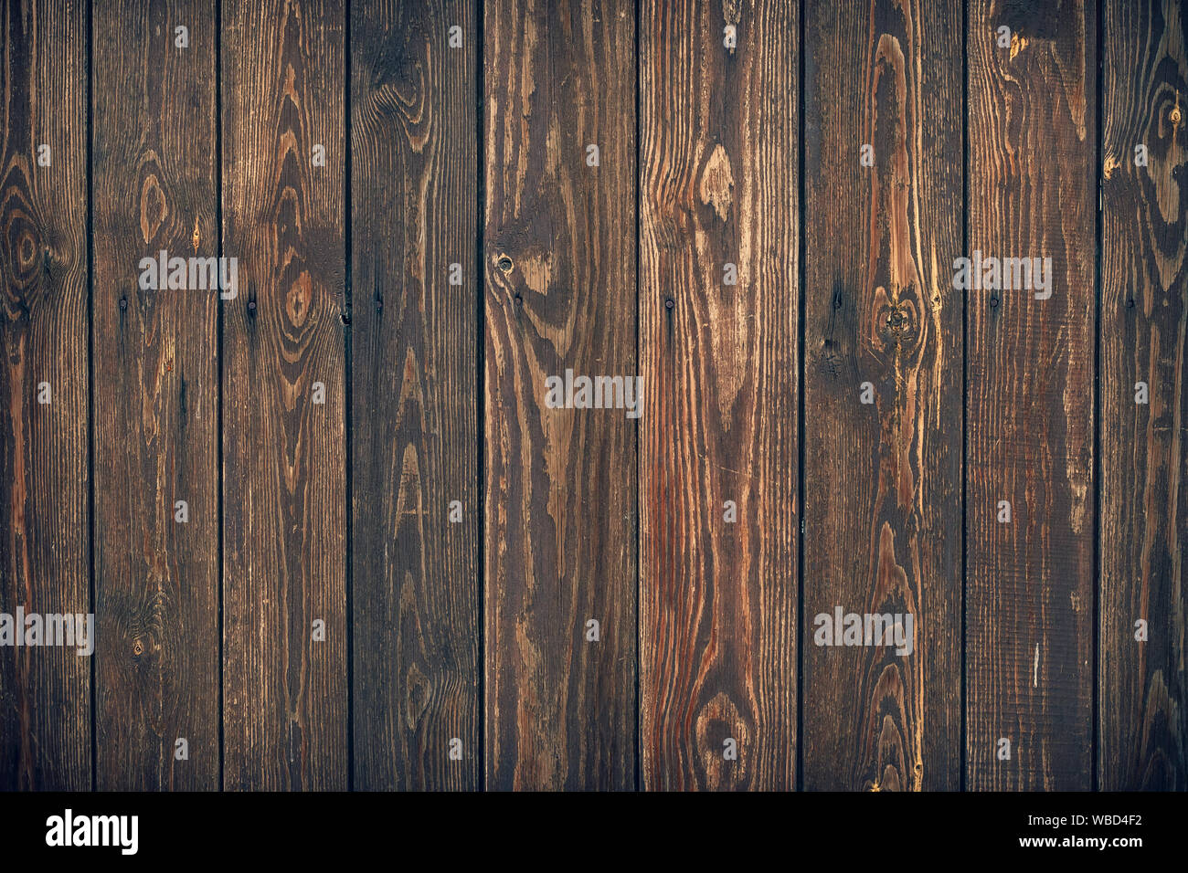 Marrone scuro listoni in legno, texture. Grunge Sfondo legno. Rustico sfondo, pattern di naturale piano di falegnameria. Parete di legno con un nodi. Scheda ruvida Foto Stock