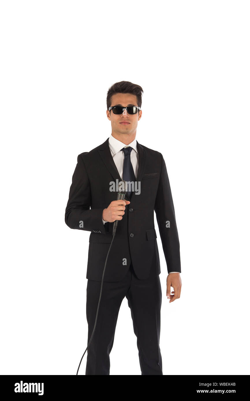 Ritratto in studio di un giovane uomo in un classico elegante abito; lo sfondo è bianco Foto Stock