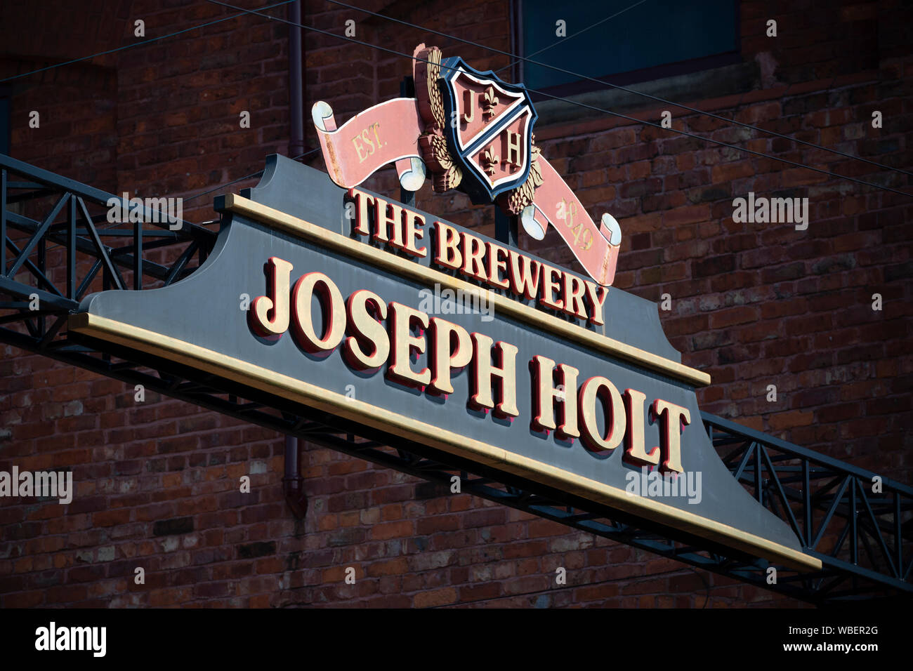 Segnaletica per Joseph Holt birreria situato su Empire Street nella zona di Strangeways di Manchester, UK. Foto Stock