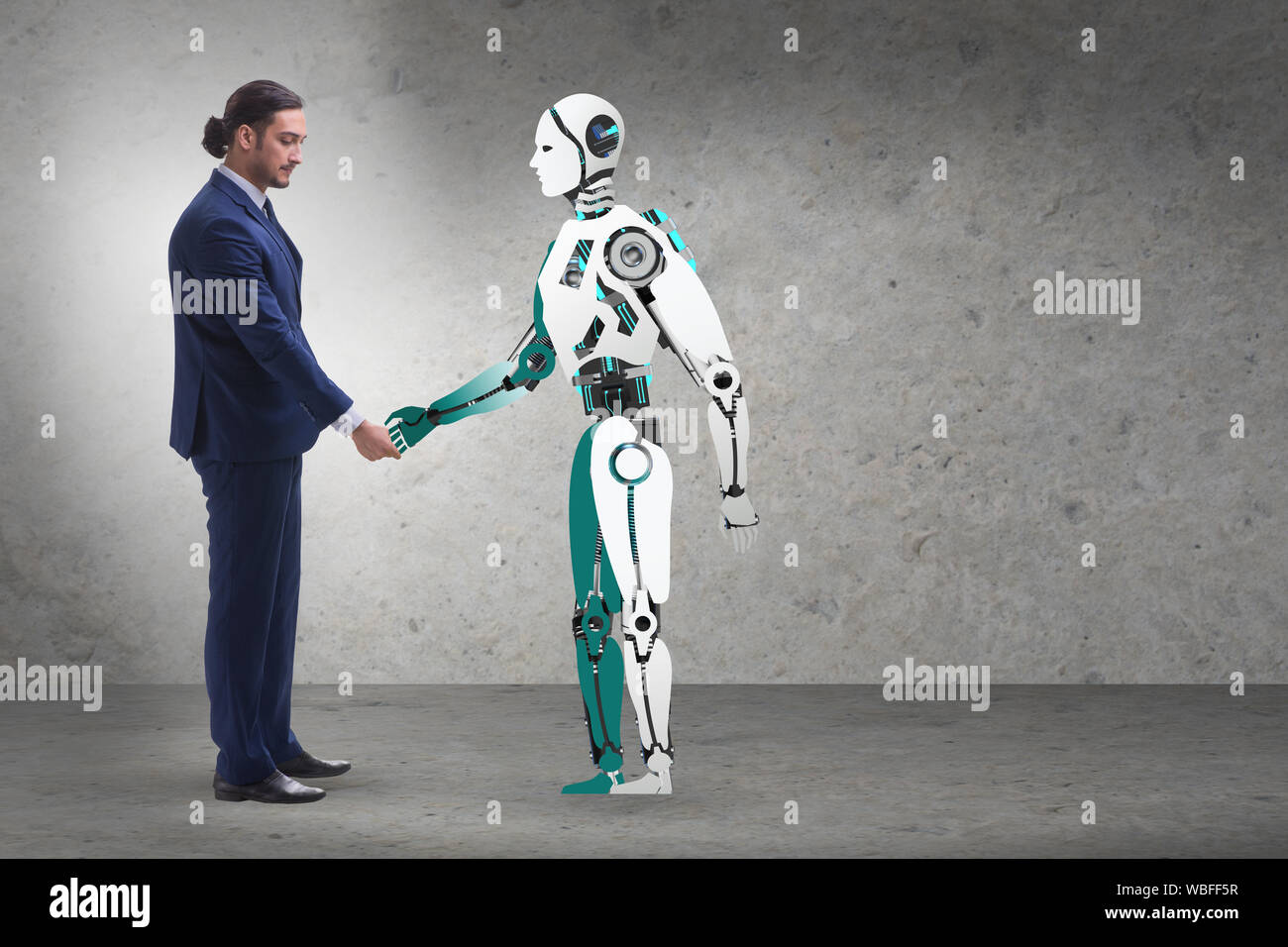 Il concetto di cooperazione tra uomo e robot Foto Stock