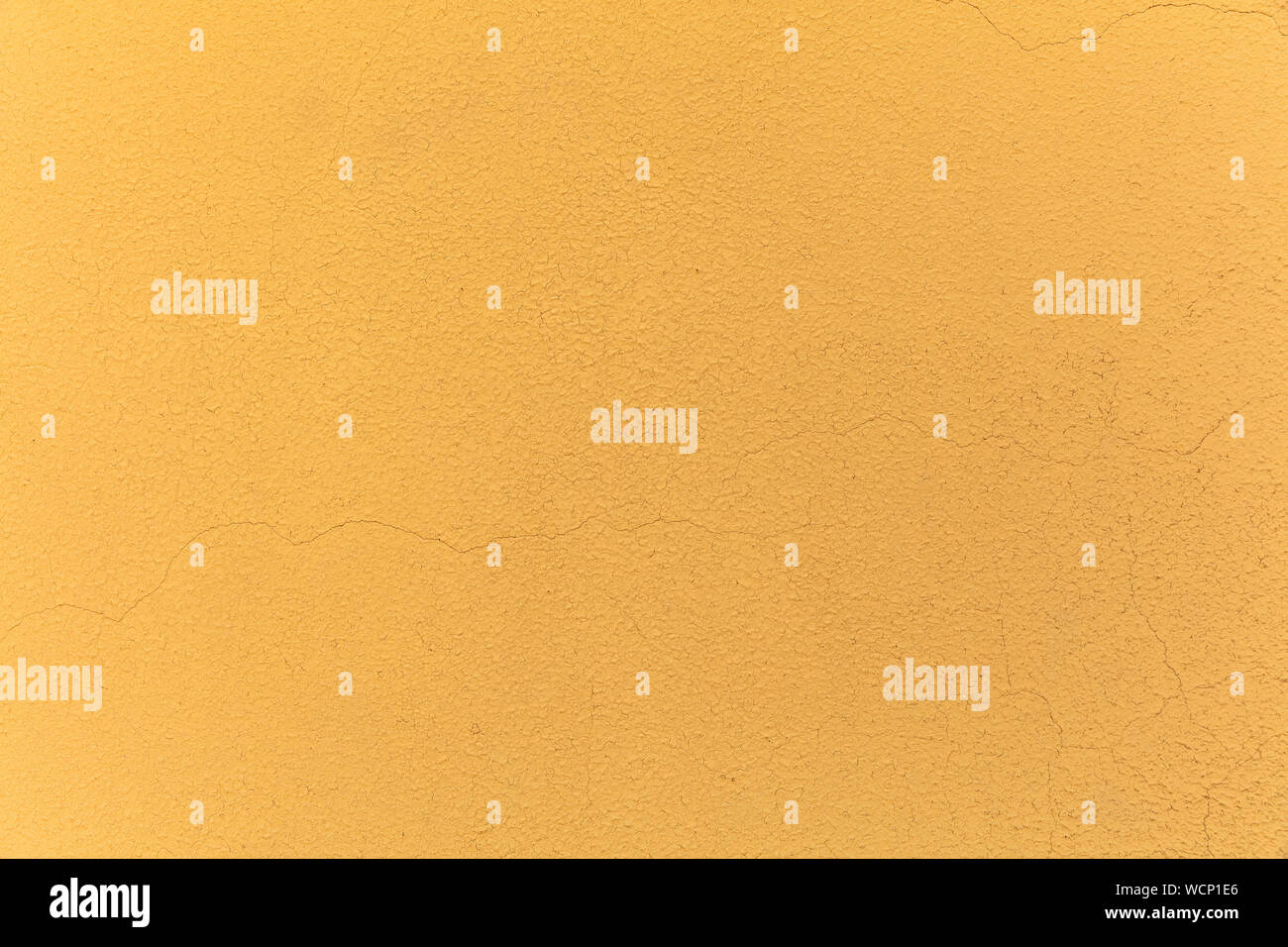 Giallo a trama parete rappresentata - Stucco / effetto Affresco con piccole increspature e trucioli Foto Stock