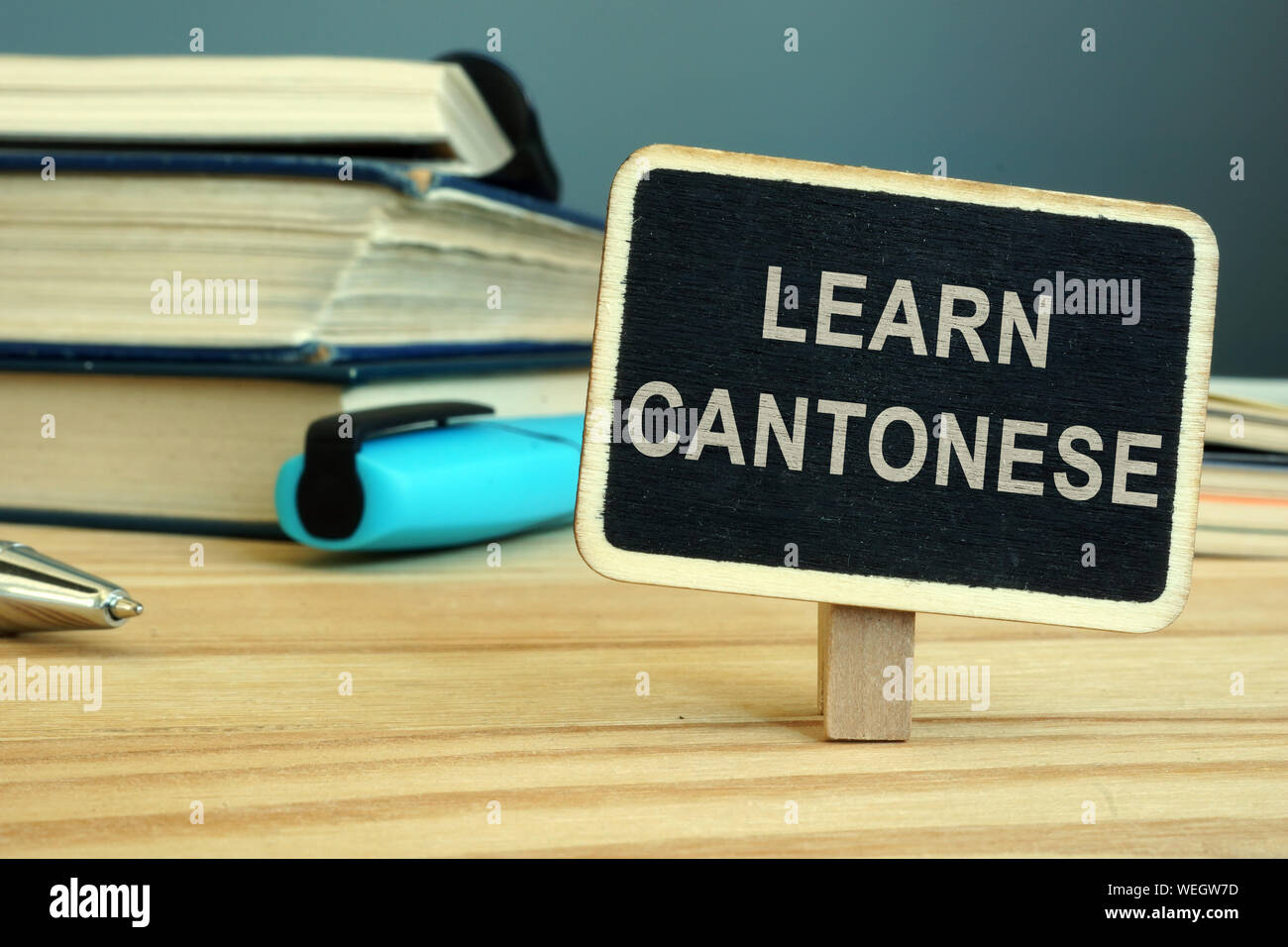 Imparare la lingua cantonese concetto. Prenota e notebook. Foto Stock