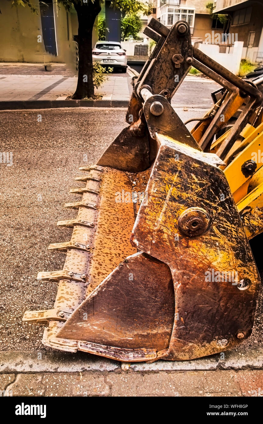 Macchina di scavo per lo scavo di terreni e asfalto Foto Stock