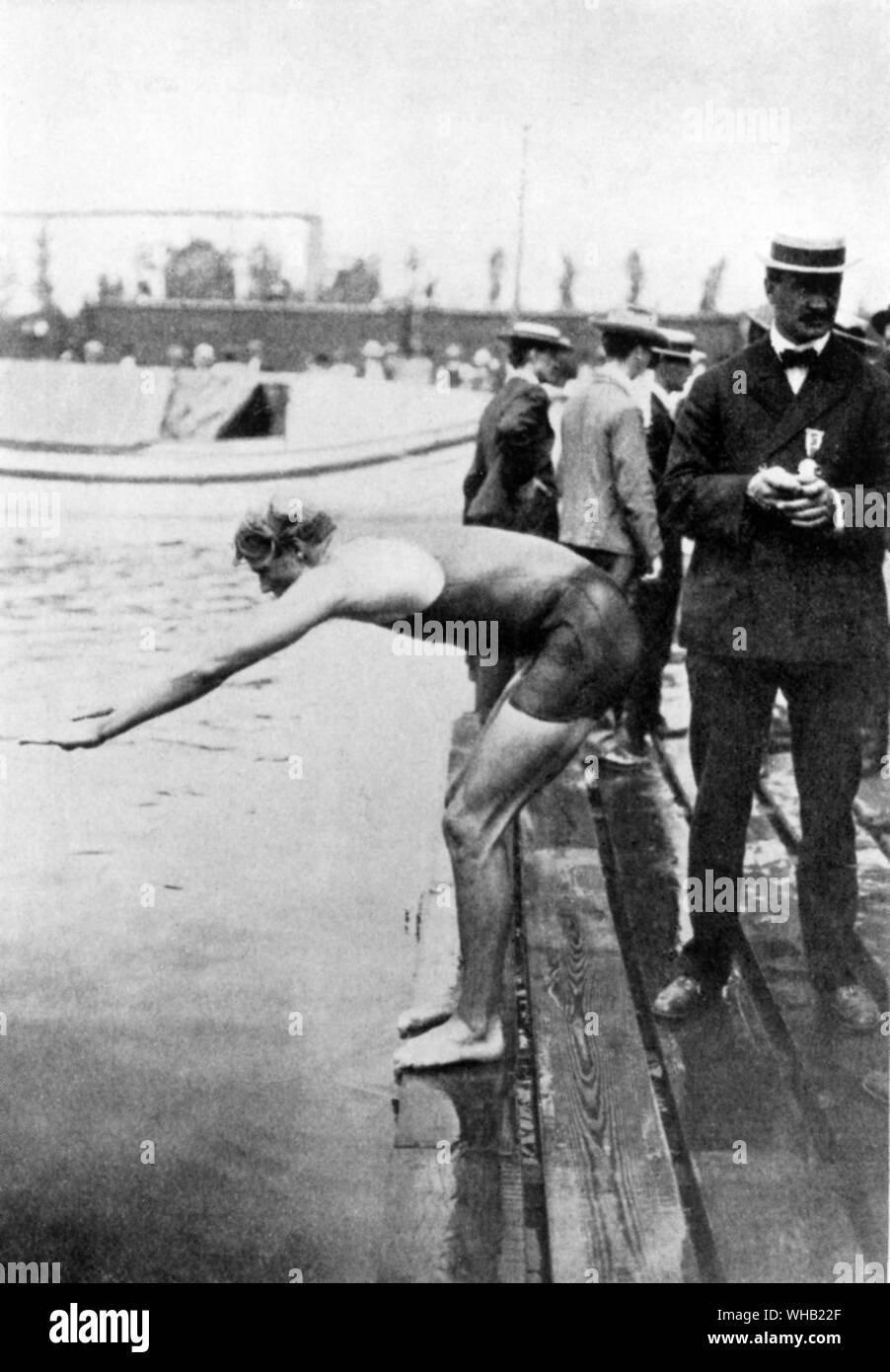 St Louis, USA.Giochi Olimpici 1904: Charles Daniels circa per avviare il suo evento di nuoto.. Foto Stock