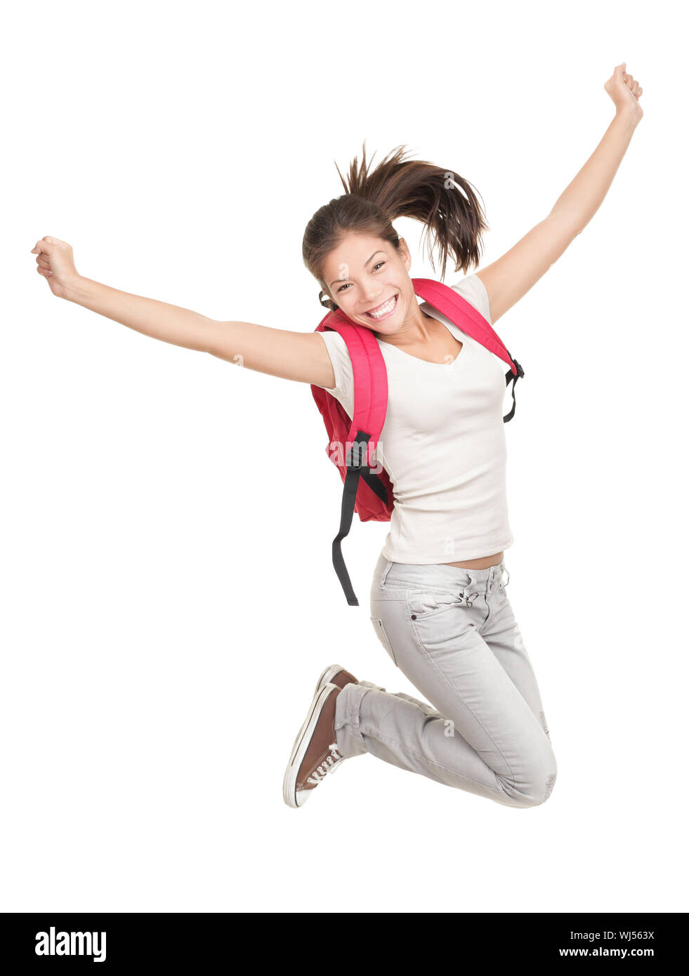 Jumping collegio femminile / Studente universitario isolati su sfondo bianco. Giovane donna asiatica studenti caucasici. Foto Stock