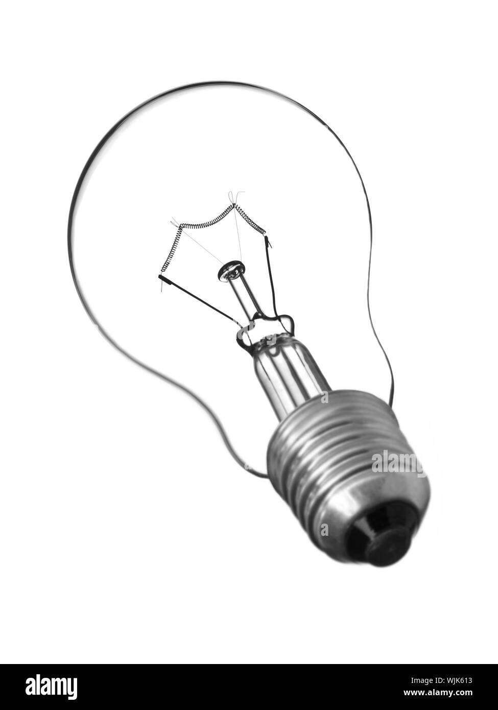 Una trasparente lampadina luce isolato su bianco. Foto Stock Una trasparente lampadina luce isolato su bianco. Foto Stock