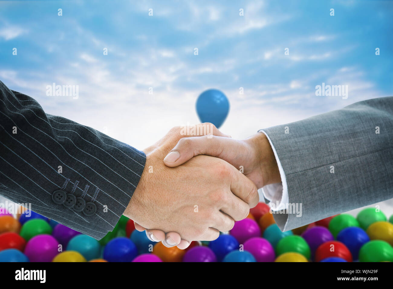 Immagine composita di handshake business contro terra futuristica galleggianti in aria Foto Stock