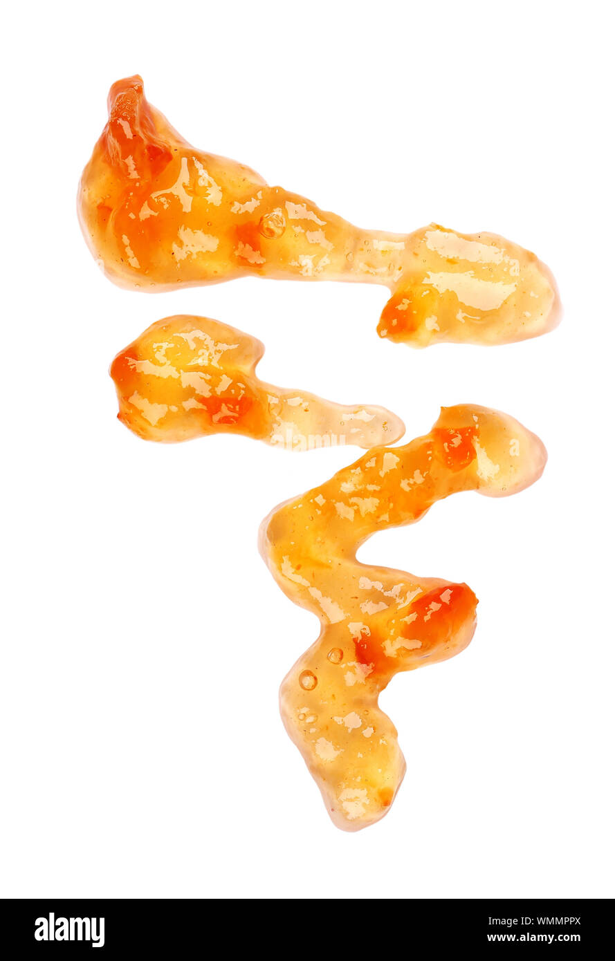 Arancione inceppamento spessa pioggerella, isolati su sfondo bianco. Mandarino marmellata, salsa topping scende. Vista dall'alto. Foto Stock