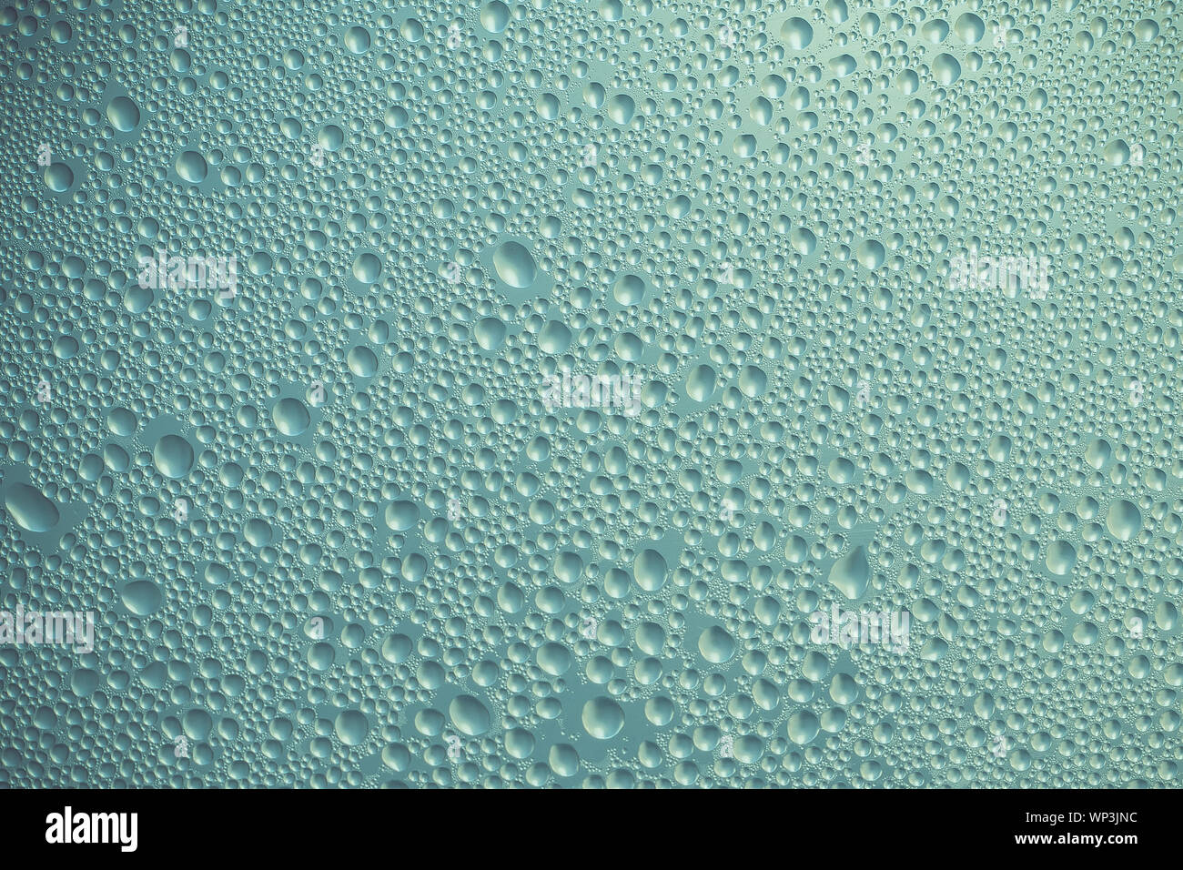 Verde e grigio metallo texture con piccoli cerchi. Turchese sfondo metallico con bolle. Shiny superficie convessa. Configurazione astratta di glitter di vetro. Foto Stock