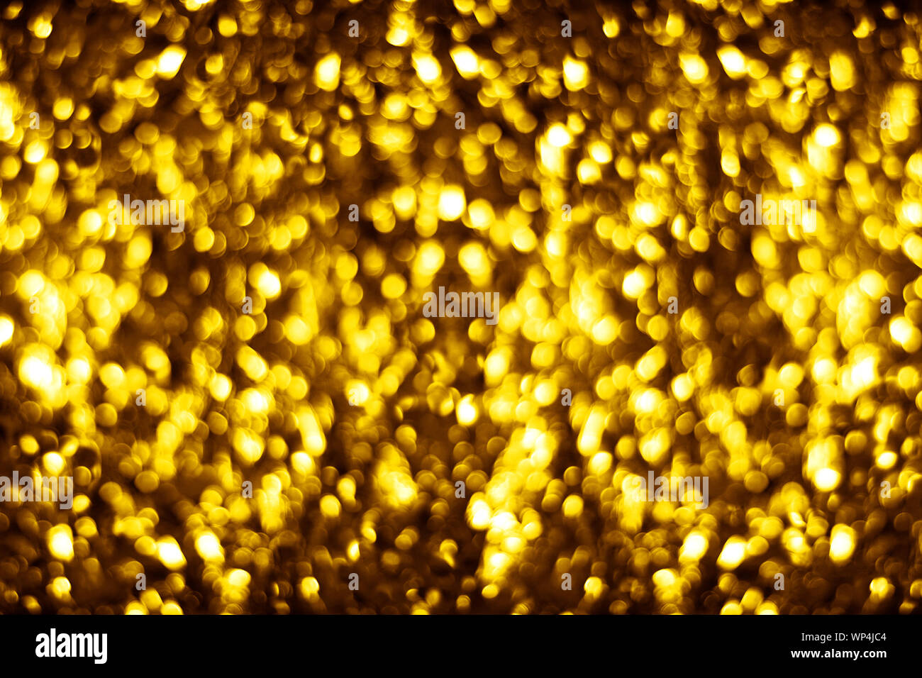 Golden sfocato shining bokeh sfondo giallo sfocati brilla sullo sfondo di colore oro round bolle telaio blur, luci luminose festosa confine design Foto Stock