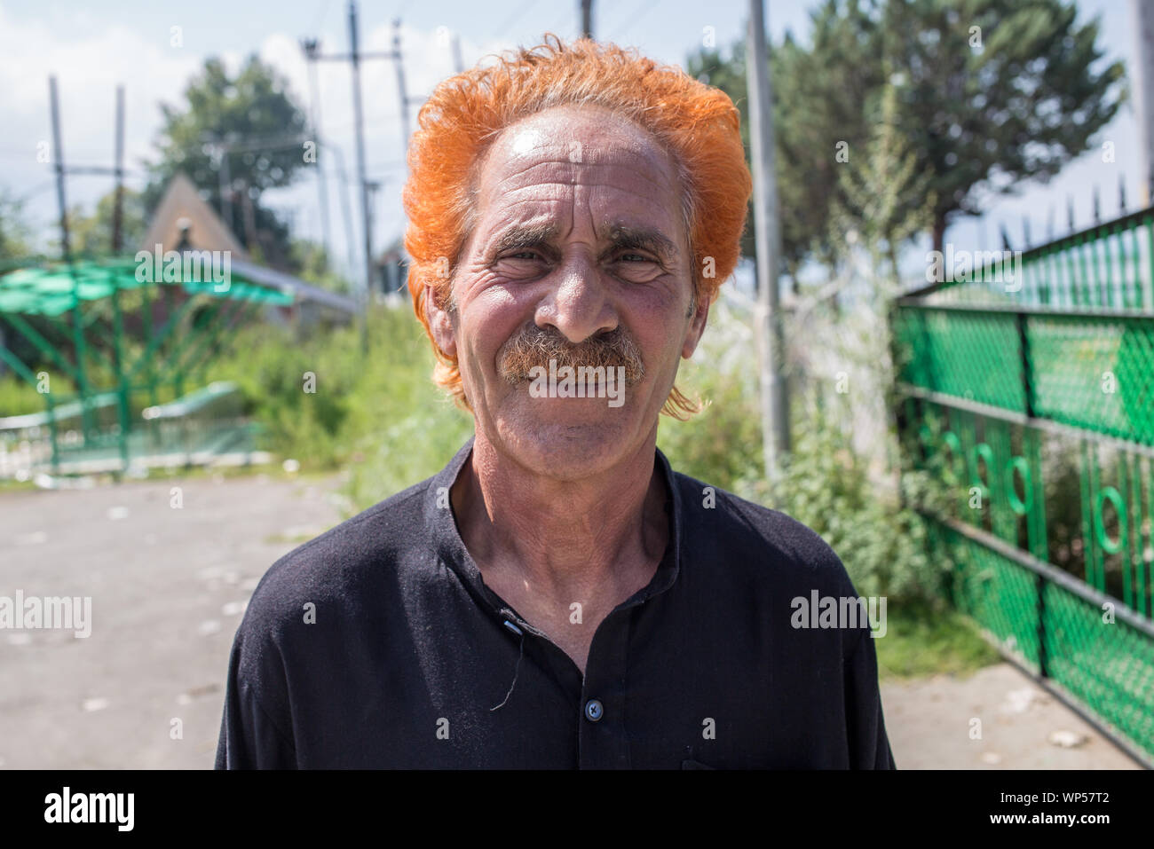 Un ritratto di un dai capelli rossi l uomo a Srinagar, India. Foto Stock