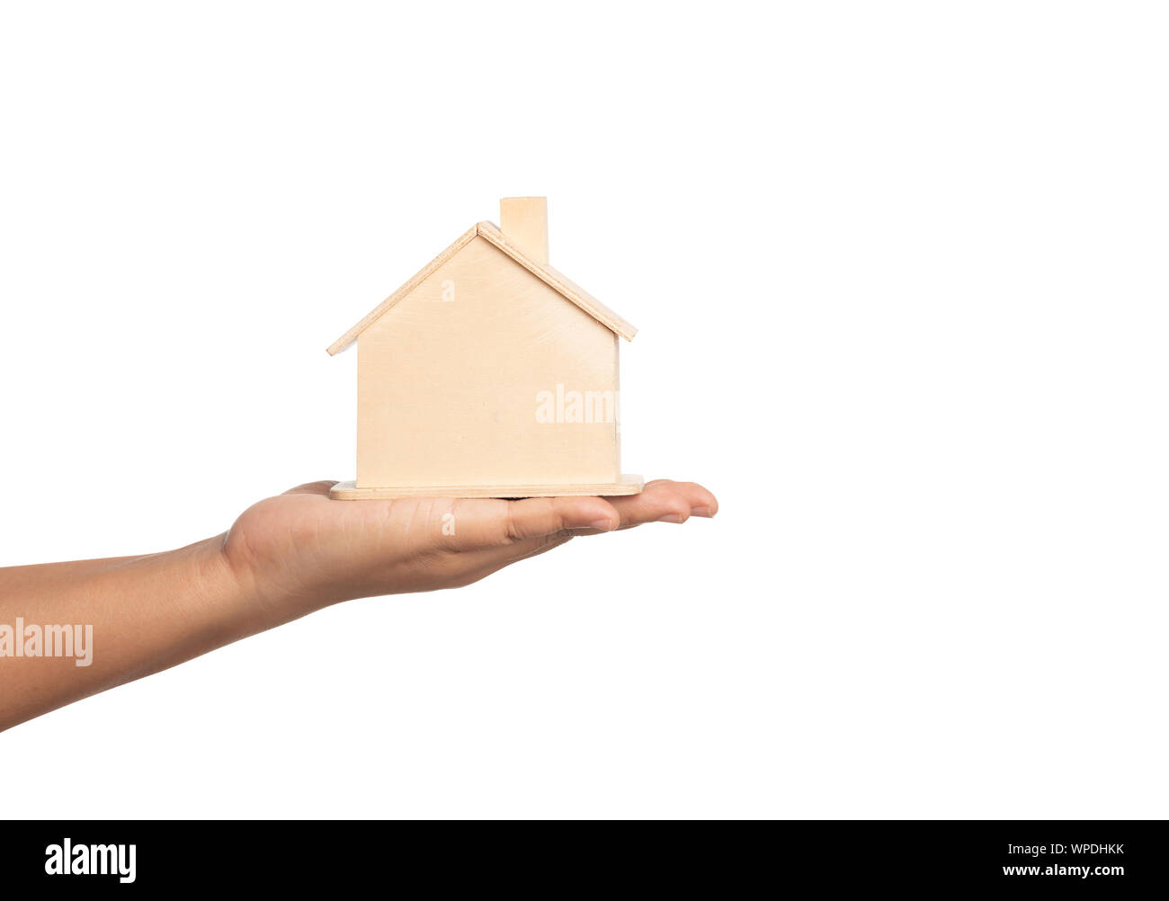 Piccola casa modello sul lato delle donne isolate su sfondo bianco. Dando il concetto Casa. Azienda umana la proprietà a portata di mano con finanze concetua Foto Stock