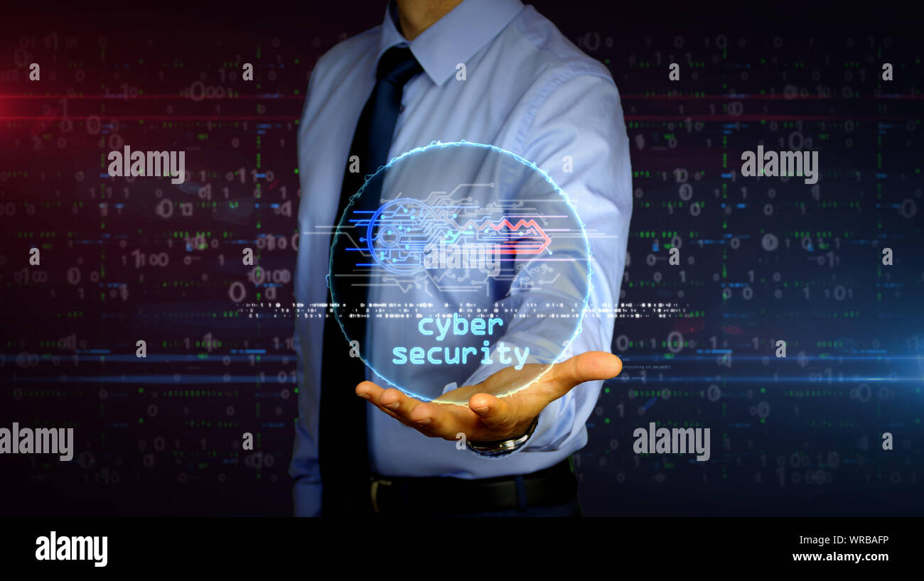 Uomo con dynamic cyber simbolo chiave ologramma su mano. Imprenditore e futuristico concetto di sicurezza del computer, la crittografia e la protezione tramite password con l Foto Stock