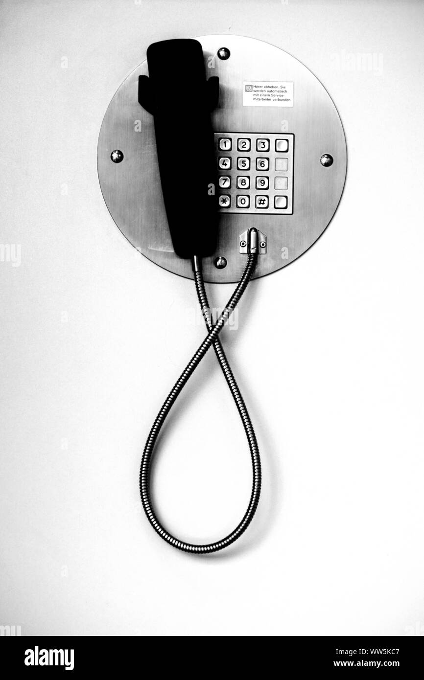 Close-up di un telefono a pagamento in bianco e nero, Foto Stock