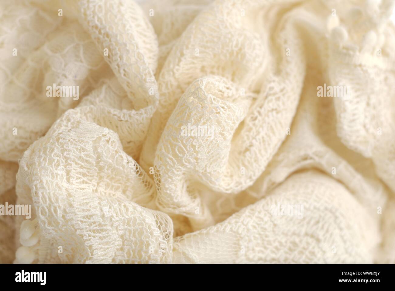 Colore avorio maglione a crochet. Texture Detail close up. Studio shot. Foto Stock