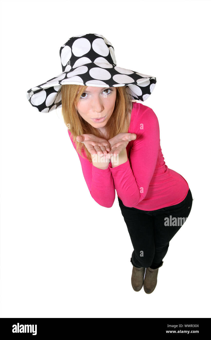 Giovane donna si soffia un bacio Foto Stock