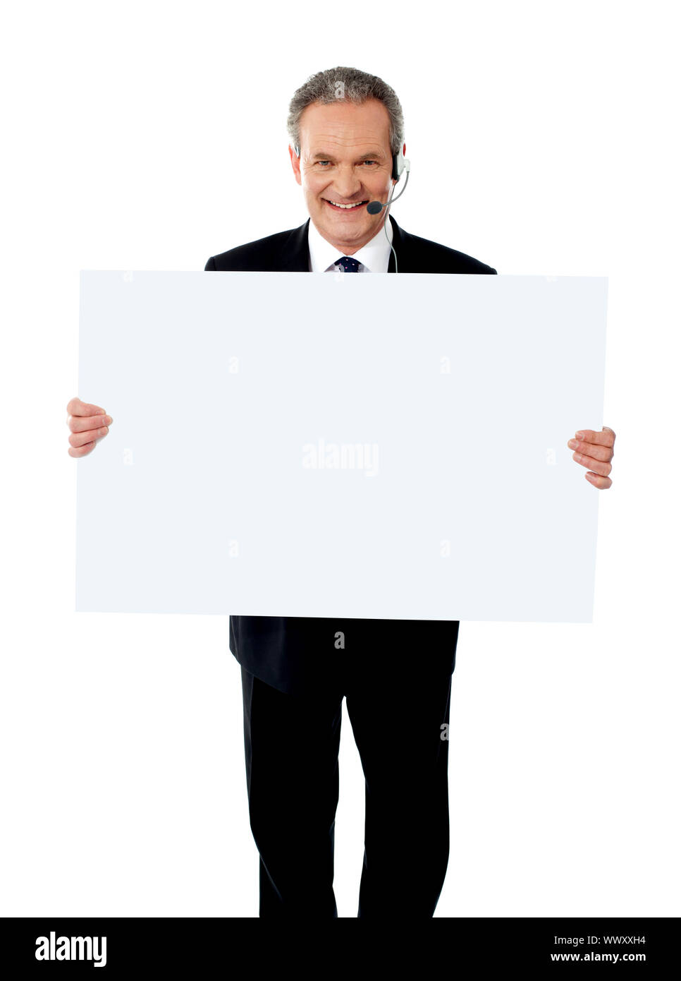 Help desk mostrando executive white billboard indossando le cuffie Foto Stock