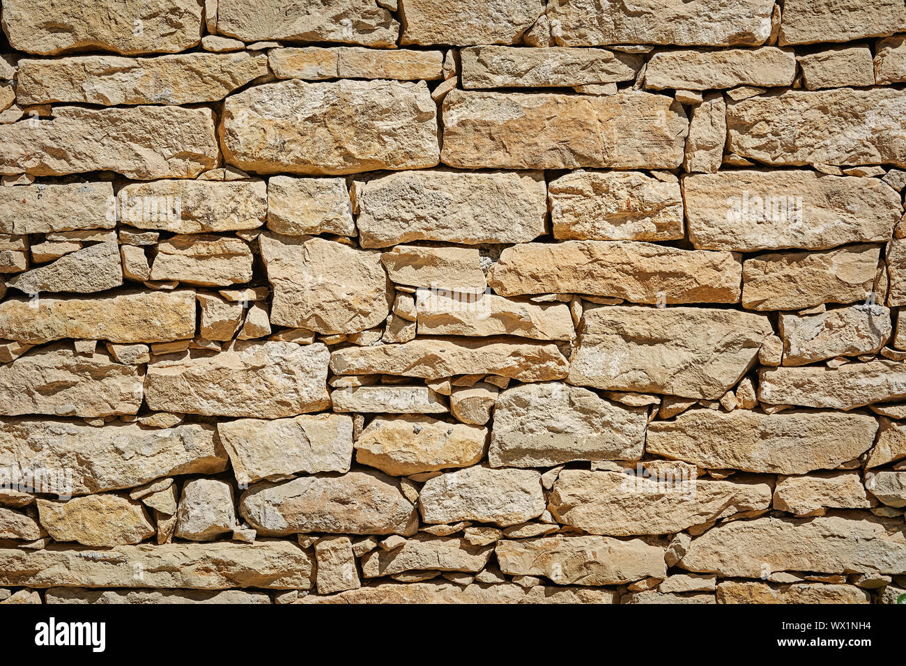 Muro di pietra sullo sfondo Foto Stock