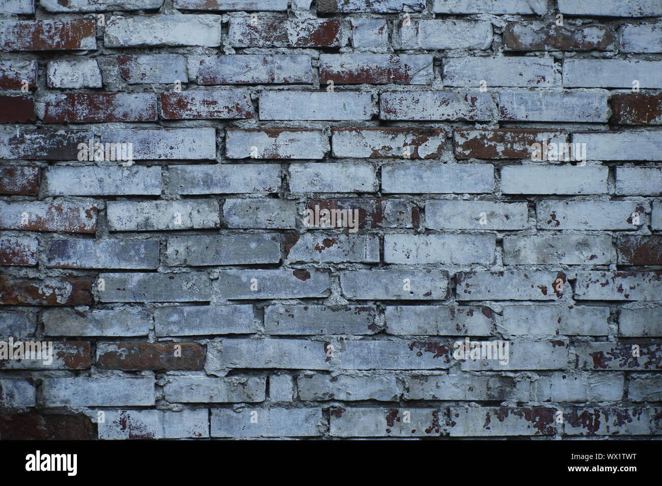 Immagine di sfondo: un frammento di un vecchio muro in mattoni. Foto Stock