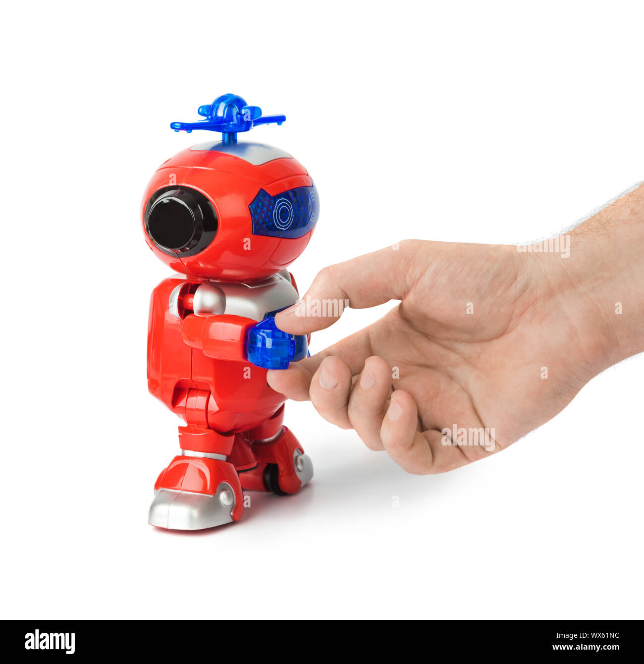 Handshake con robot giocattolo Foto Stock
