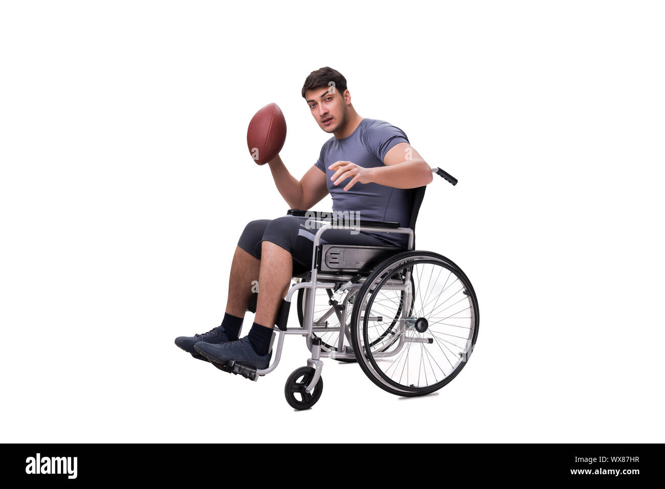 Giocatore di football di riprendersi dal pregiudizio subito su una sedia a rotelle Foto Stock