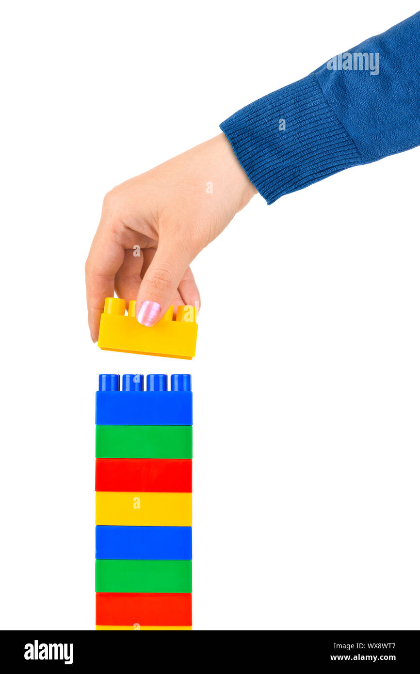Mano e torre del giocattolo Foto Stock