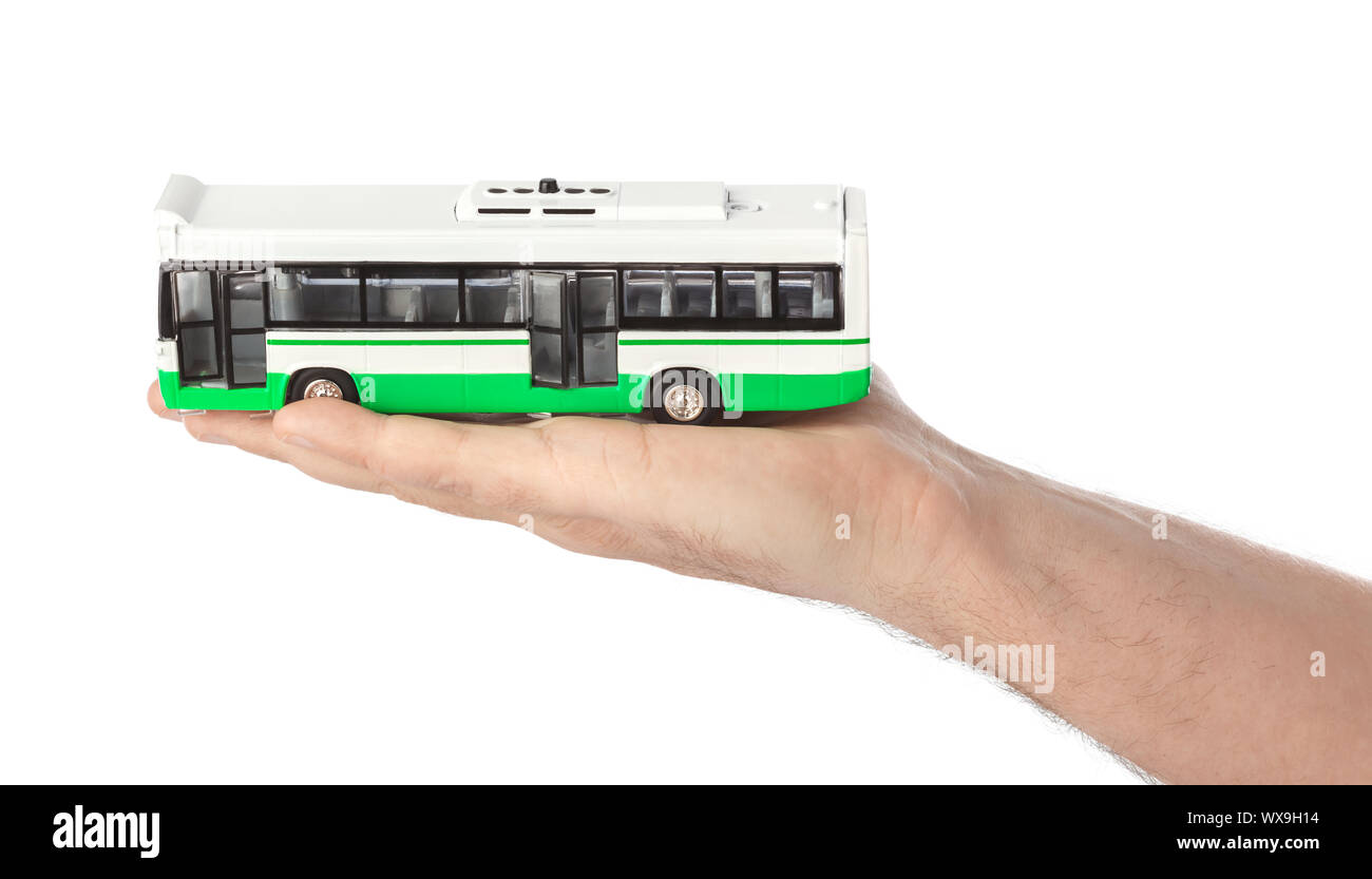 Mano con bus giocattolo Foto Stock