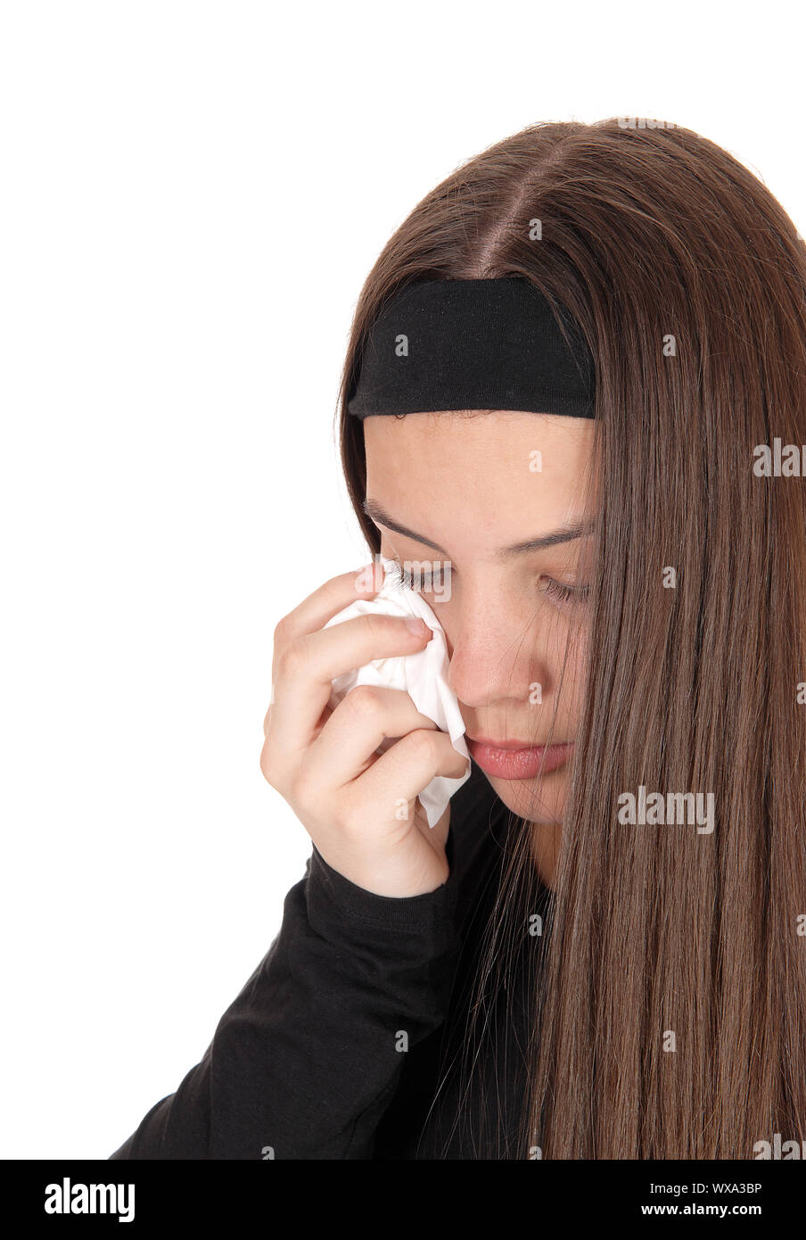 Il pianto adolescente ragazza con lunghi capelli bruna Foto Stock