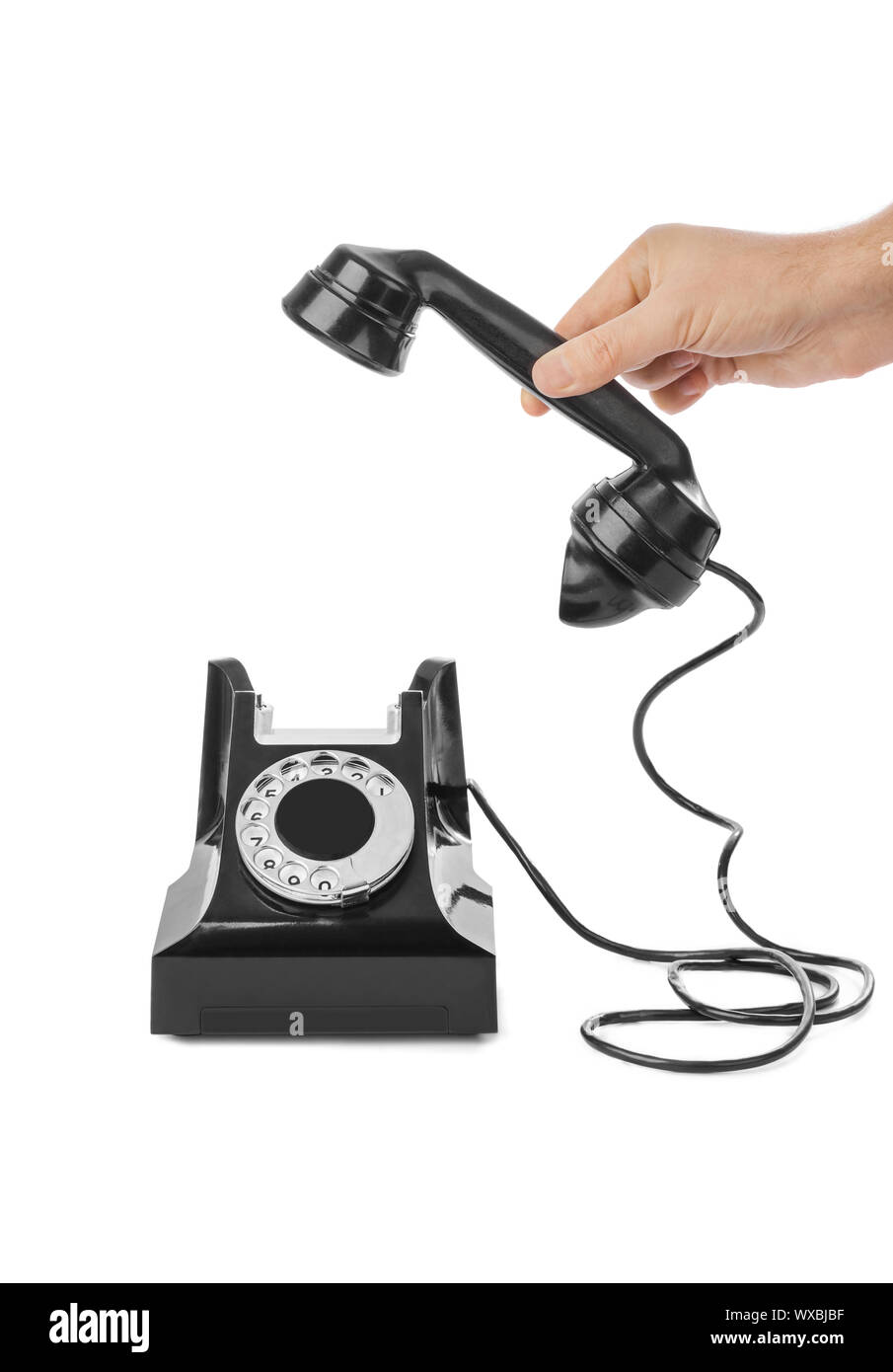 Mano e telefono vintage Foto Stock