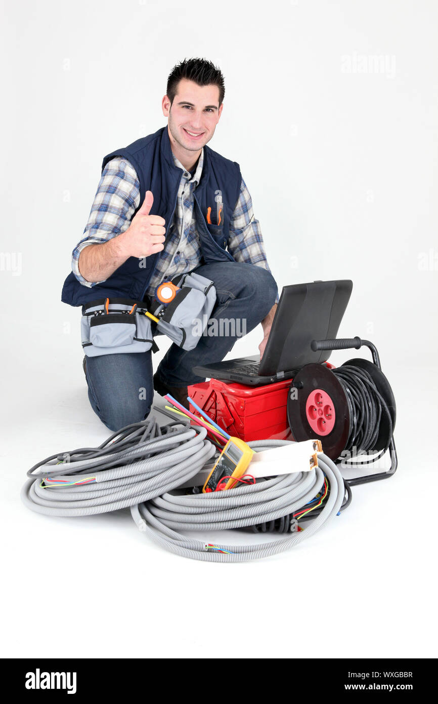 Elettricista dando il pollice fino Foto Stock