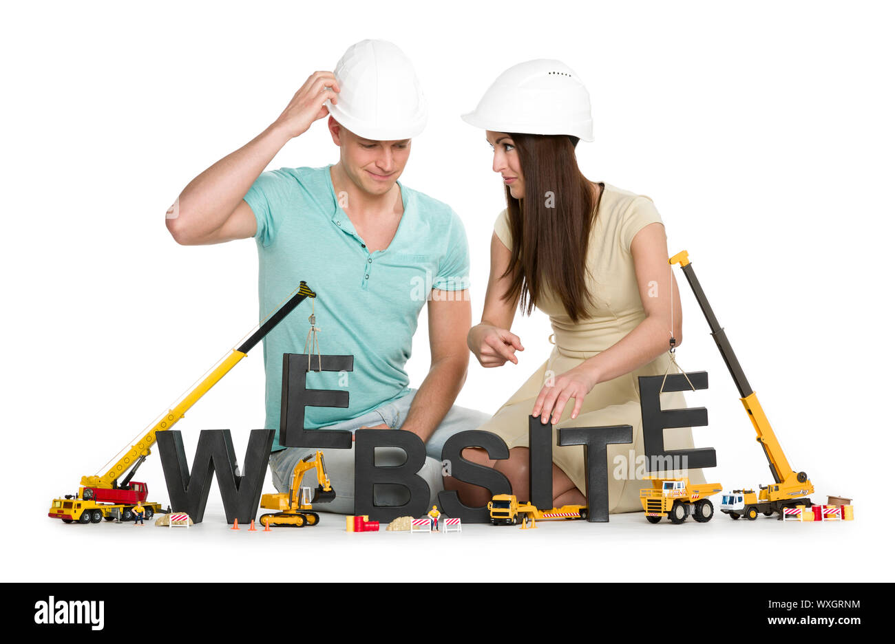 Sito web in costruzione: gentile uomo e donna edificio sito web-parola. Foto Stock