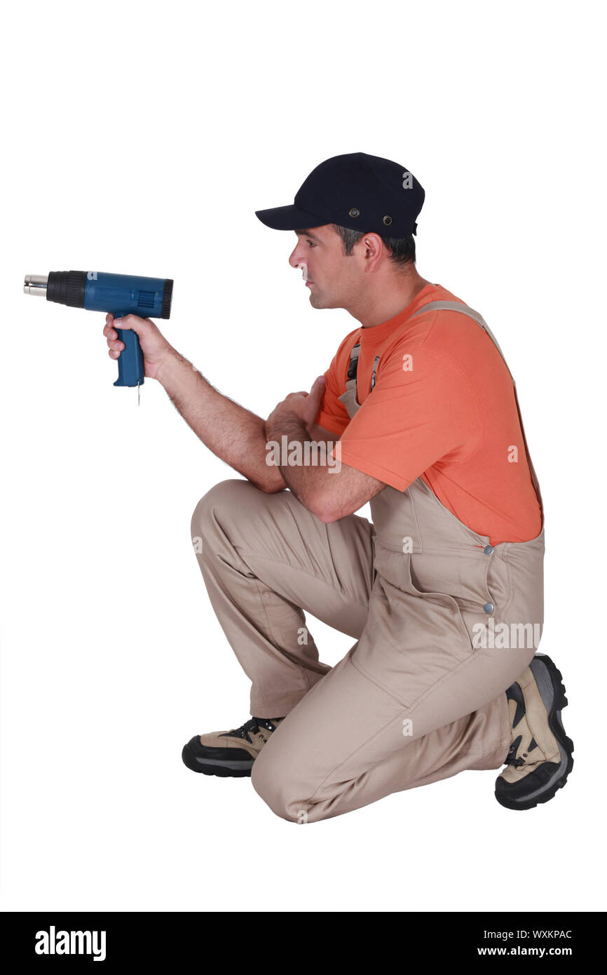 Artigiano lavora con un trapano Foto Stock