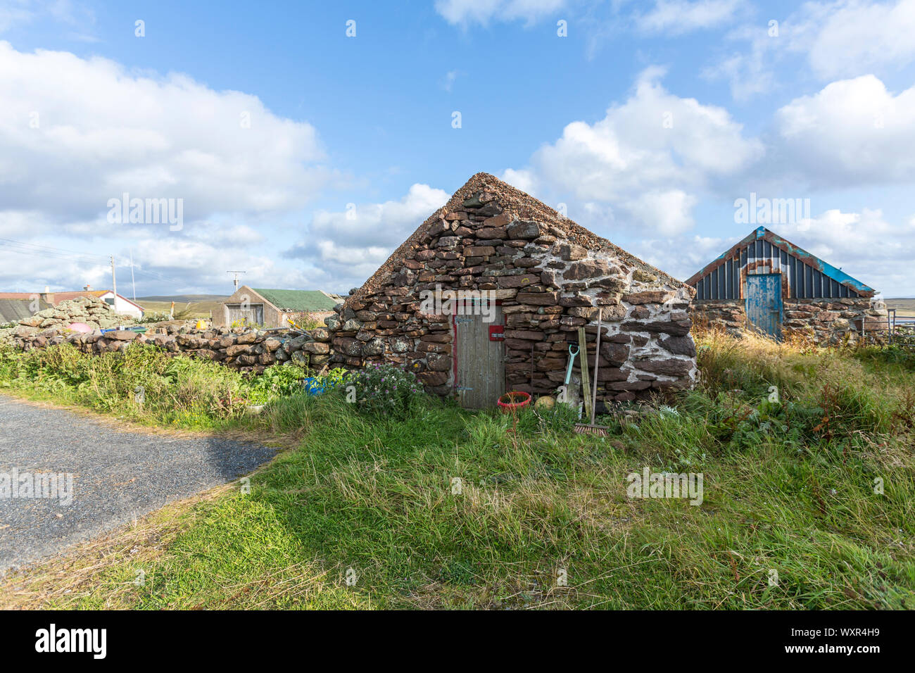 Rifugio di pietra in Hamnavoe, Continentale, le isole Shetland, Scotland, Regno Unito Foto Stock