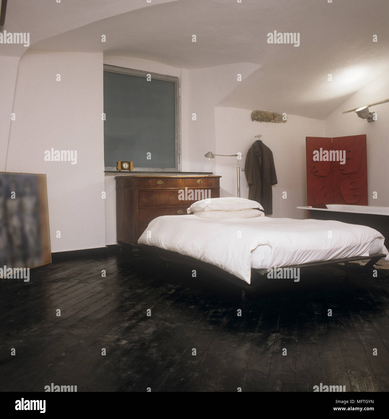 Bedroom With Double Bed And Freestanding Bathtub Stock Photo
